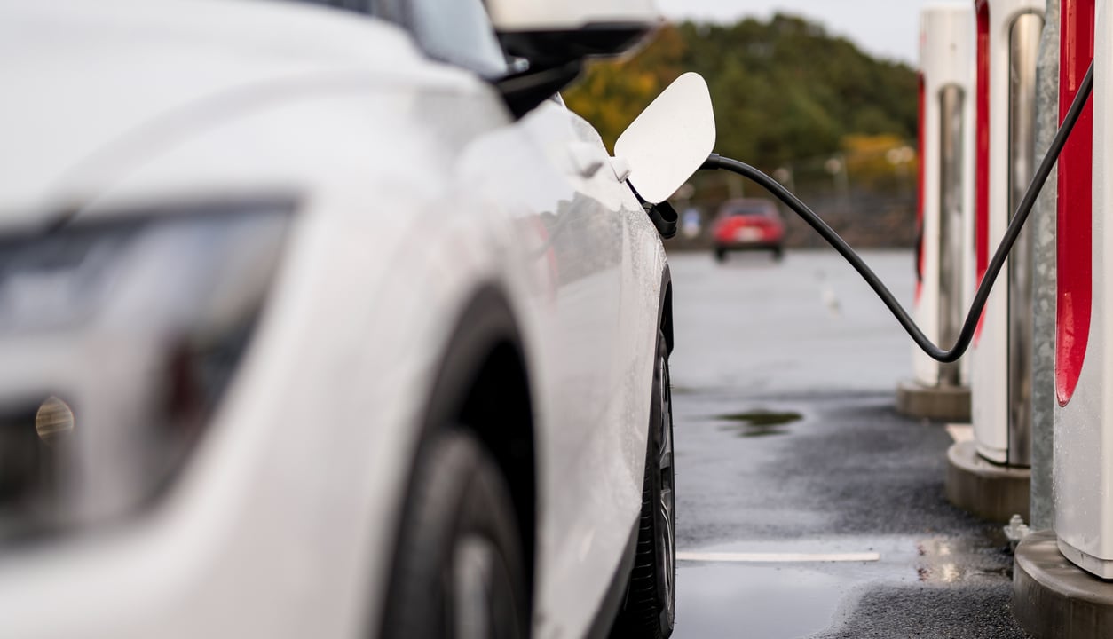 Electric vehicle charging battery at a charging station in the city. ...